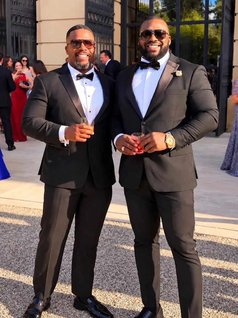 15 Plus Size Groom Outfit Ideas Trending in 2026 8 Two Black Tuxedos, One Satin Lapel and One Matte